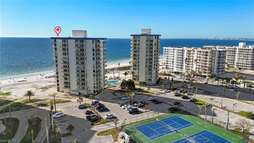 Drone / aerial view with a water view and a view of the beach
