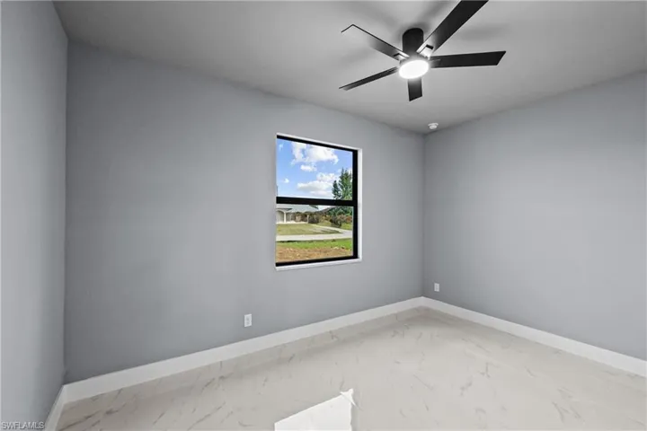 Spare room featuring ceiling fan