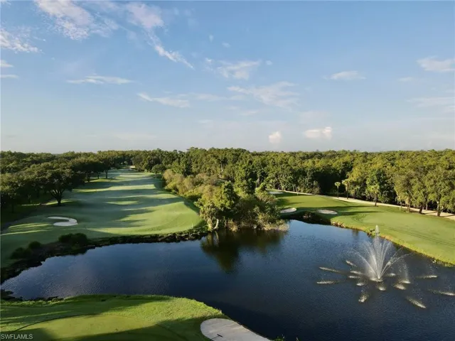 View of home's community featuring view of golf course and a water view