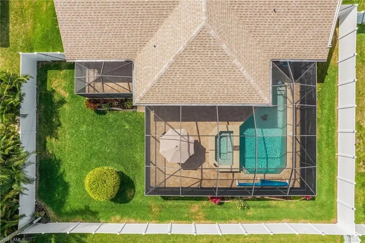 View of subject property with a pool