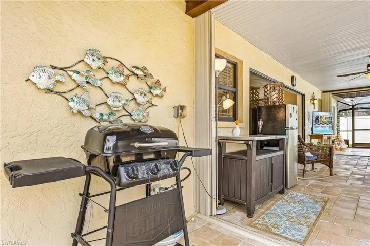 View of patio / terrace featuring a ceiling fan and grilling area