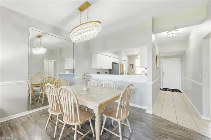 Dining area featuring wood-finish flooring and a crystal chandelier