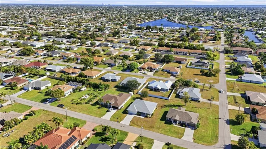 Aerial overview of property's location with nearby suburban area and a large body of water