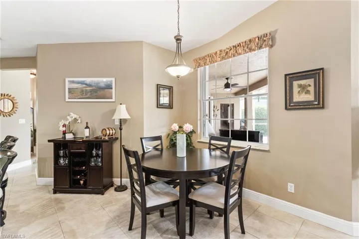 Tiled dining space with ceiling fan