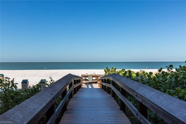 View of nearby features with a view of the beach and a water view