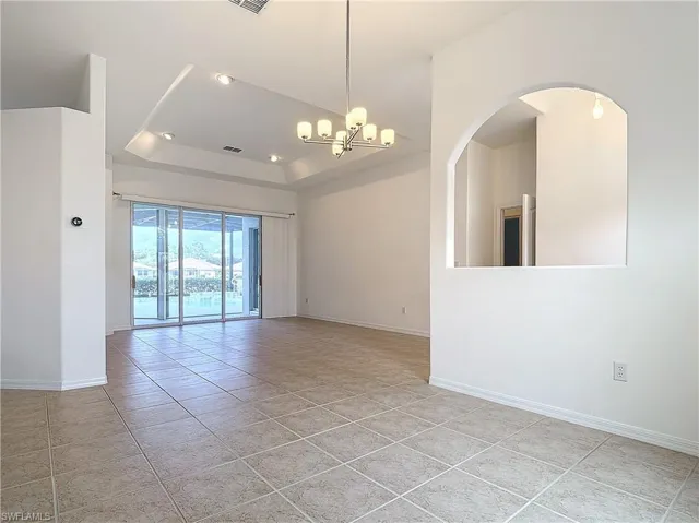 Formal Dining & Living Area Looking out to the Lake & Pool