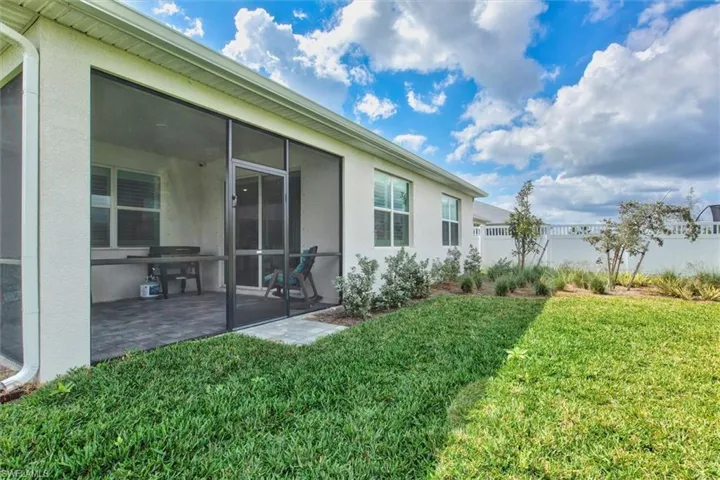 View of yard featuring a sunroom