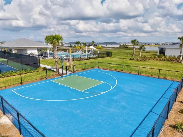 View of sport court featuring community basketball court and a residential view