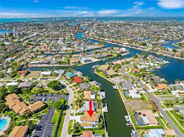 Aerial view featuring a residential view and a water view