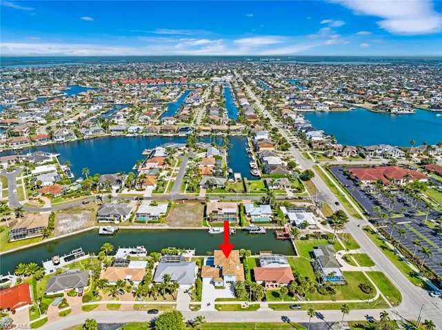Birds eye view of property with a residential view and a water view