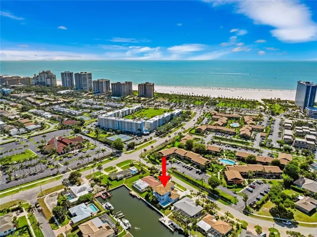 Aerial view with a beach view, a view of city, and a water view