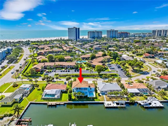 Aerial view featuring a view of city and a water view