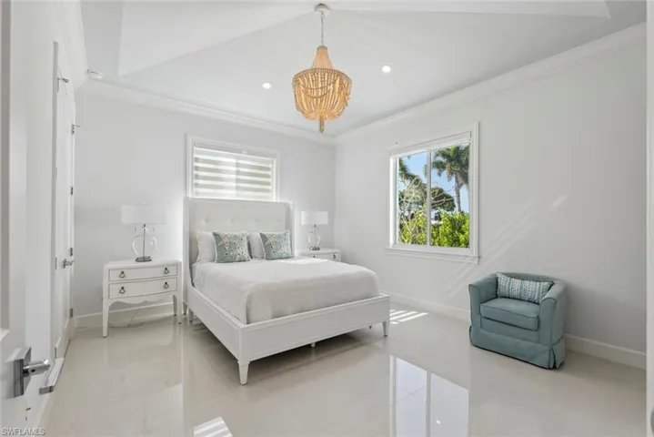 Bedroom with recessed lighting, baseboards, and crown molding