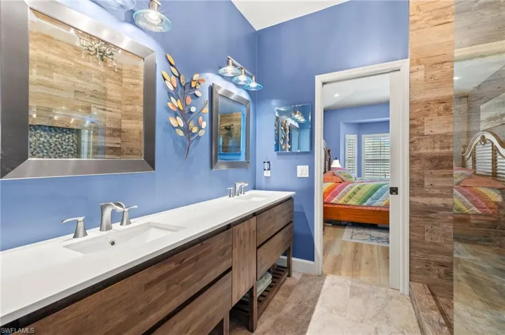 Ensuite bathroom featuring double vanity