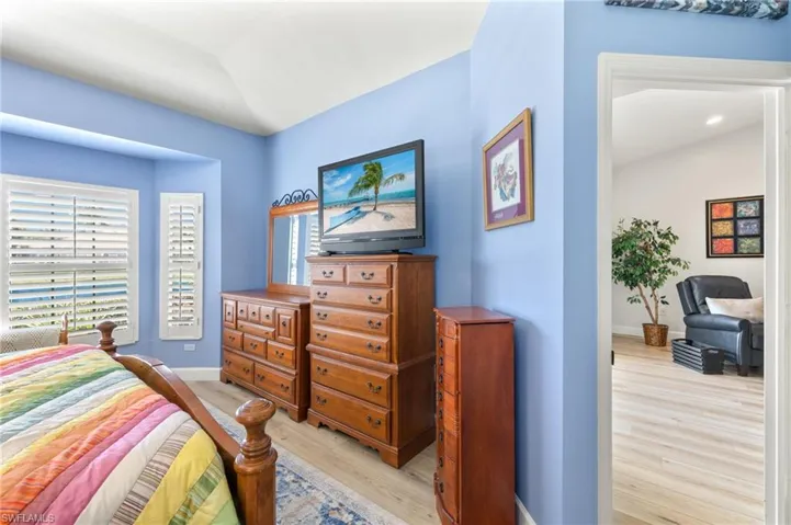 Bedroom featuring light wood-style flooring and baseboards