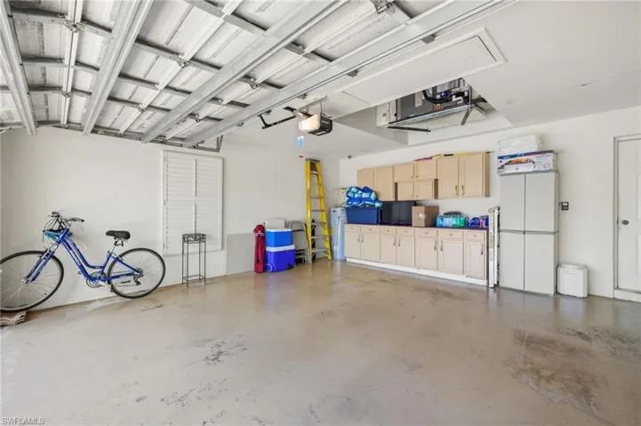 Garage featuring a garage door opener