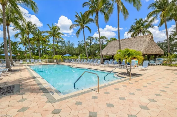 Community pool with a patio