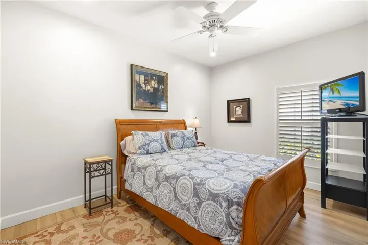 Bedroom with light wood-type flooring and ceiling fan