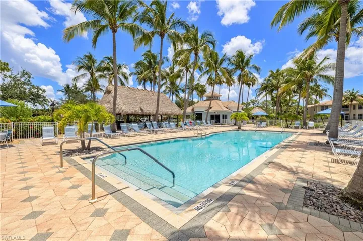 Community pool featuring a patio