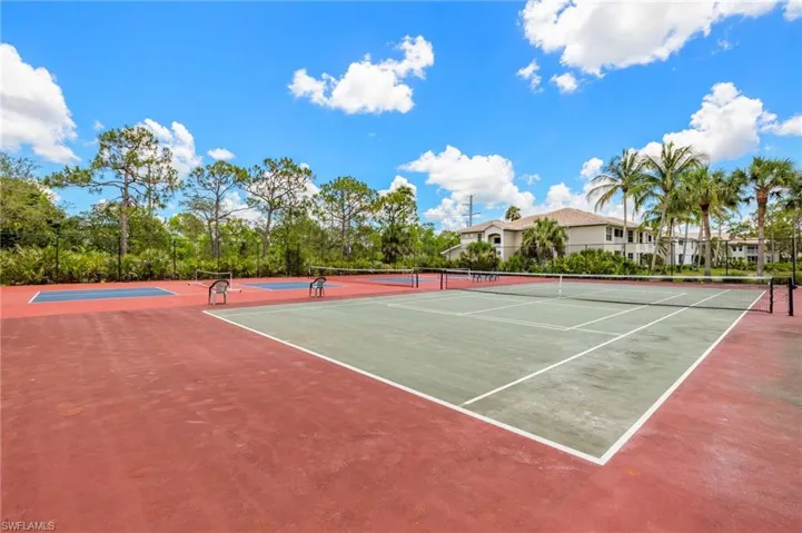 View of tennis court featuring community basketball court