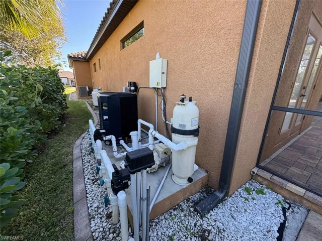 View of side of home featuring central AC unit