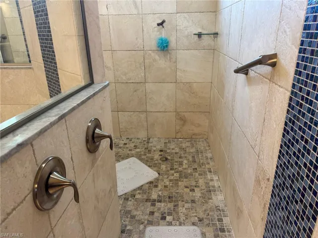 Bathroom with tiled shower