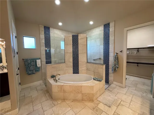 Bathroom with shower with separate bathtub