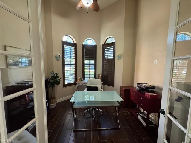 Office area featuring dark hardwood / wood-style flooring