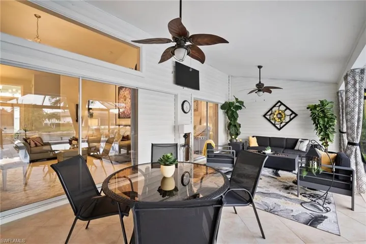 View of patio / terrace with ceiling fan and an outdoor living space