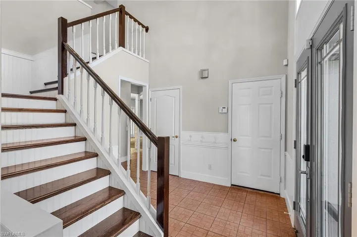 Foyer featuring a towering ceiling