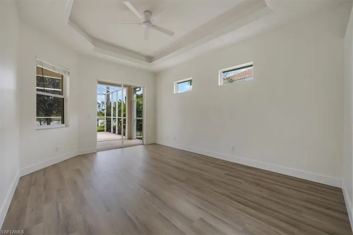 New floors, paint, and fan, primary has direct access to extended lanai