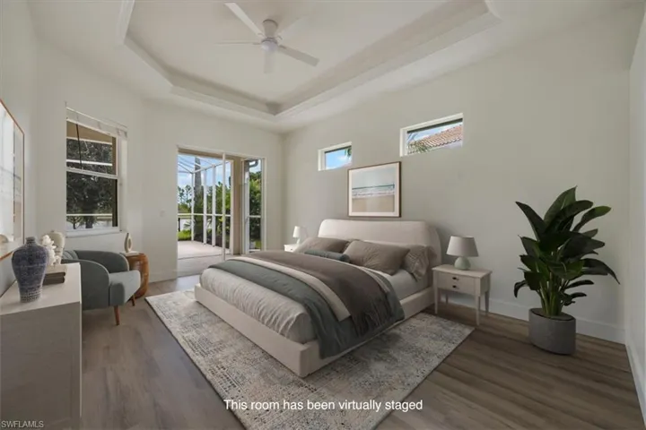 Virtually staged New floors, paint, and fan, primary has direct access to extended lanai