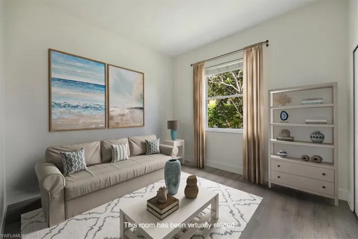 Virtually staged new floors and baseboards, fresh paint and natural light