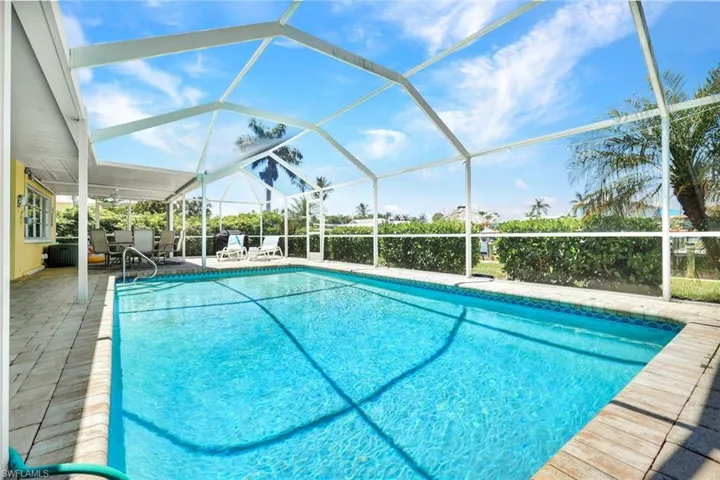 Huge paver deck for catching some rays or swimming in the heated, salt, chlorine generated pool.