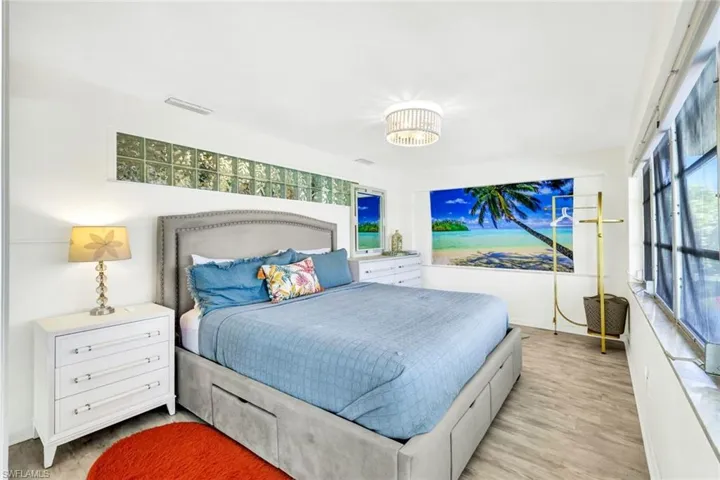 Den, used as bedroom three with french doors, and great view of pool and canal.