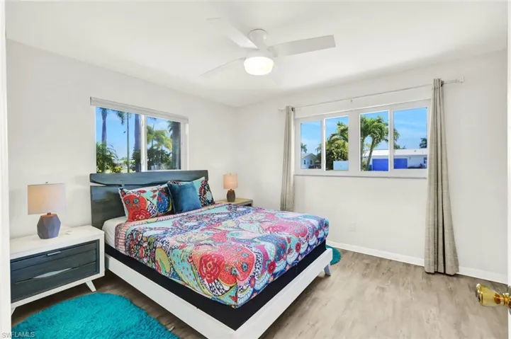 Second bedroom with updated windows and lvp flooring. Entire house all the tropical bedding, towels etc all included in the turn key.