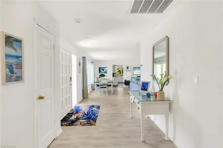 Luxury vinyl plank creates that beach vibe as soon as you enter.  delightful coastal decor throughout.