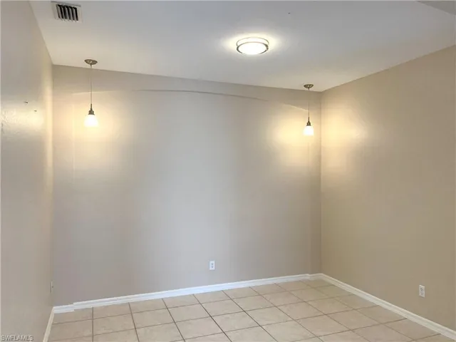 Dining Room With New Light Fixture Without Staging