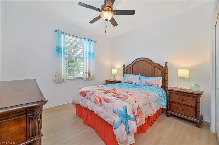Bedroom featuring ceiling fan and light wood-type flooring