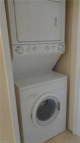 Laundry area featuring stacked washer and dryer