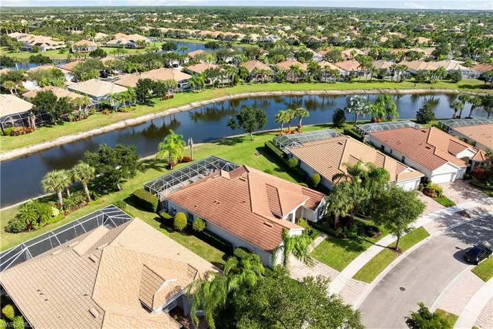 Aerial view of residential area featuring a large body of water