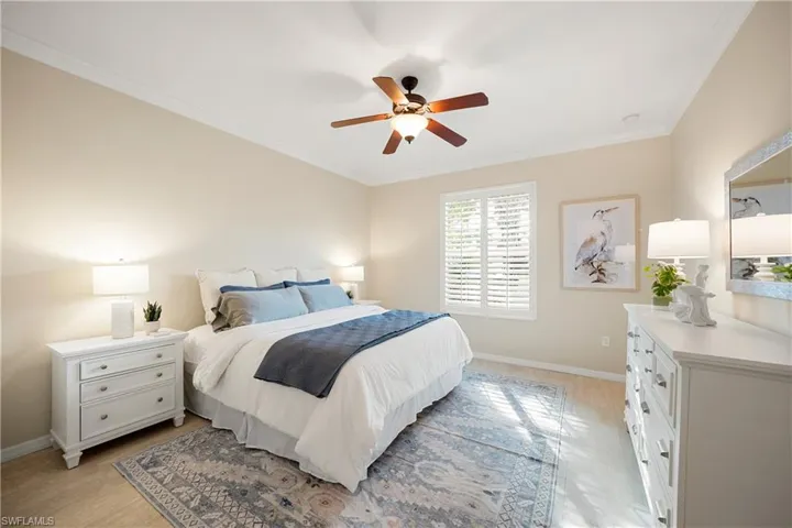 Bedroom featuring crown molding and ceiling fan