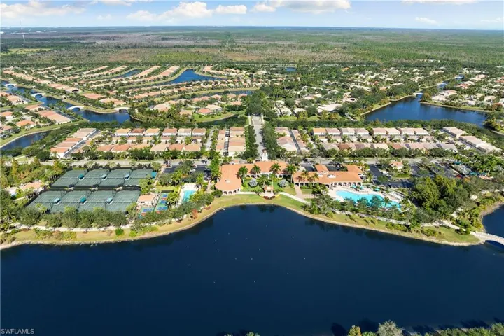 Aerial view of residential area featuring a large body of water