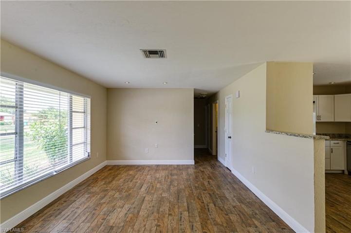 Open floor plan with lots of natural light.  Freshly painted.  Wood tile flooring for today's decor.