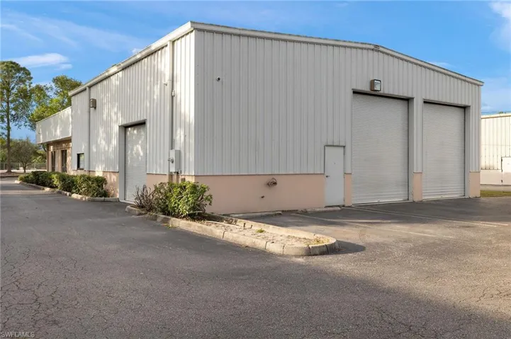 View of outbuilding featuring a garage