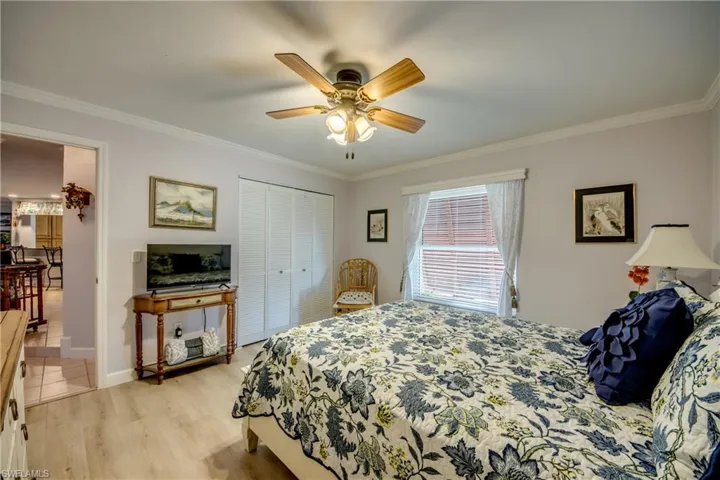 Lovely spacious guest room features LVP flooring and crown molding and is adjacent to the newly remodeled guest bathroom.