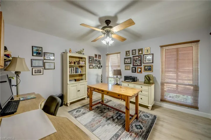 Spacious guest bedroom currently used as a home office. Features LVP flooring, 2 large impact rated windows, and an ample sized closet. Located in the guest wing of the home next to the guest bathroom.