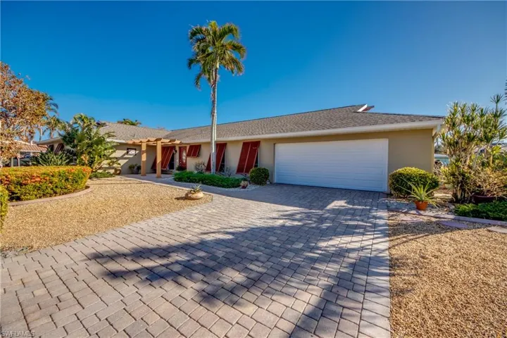 Delightful updated Pool home located on a quite cul-de-sac. Features approximately 239 Ft of water frontage just off the Caloosahatchee River. NO Bridges. Just minutes by boat to Sanibel, Back Bay or the Gulf of Mexico! Features Dock with 10 lb boat lift and davits for your smaller boat or jet skis. Meticulously maintained and upgraded. Wrap around Lanai with water views and sunset views from the Pool deck & Lanai! Home boast all impact windows and sliders, new HVAC system, Dock and Lift, and much more!