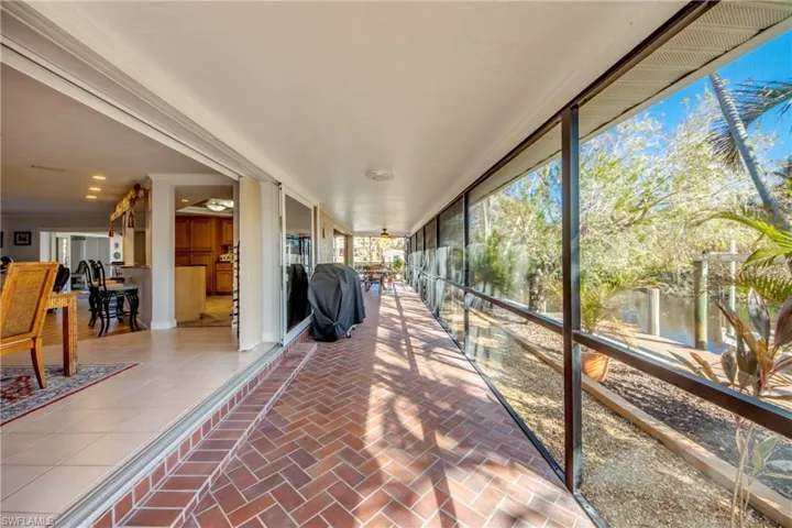 Unique wrap around Lanai offers multiple choices for covered sitting areas all with views of the waterway and access to the lovely swimming pool. All of the sliding glass doors are impact rated and pocket back allowing a fantastic flow for entertaining and allowing for the wonderful River breezes.