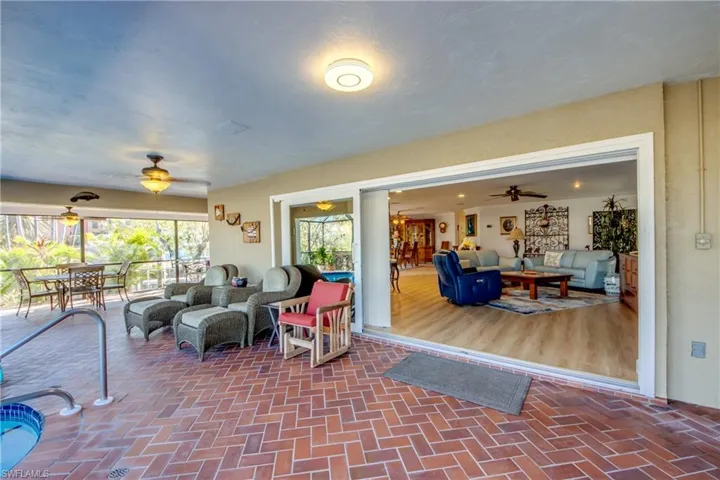 Unique wrap around Lanai offers multiple choices for covered sitting areas all with views of the waterway and access to the lovely swimming pool. All of the sliding glass doors are impact rated and pocket back allowing a fantastic flow for entertaining and allowing for the wonderful River breezes. Views from the Pool area feature River and Sunset views.